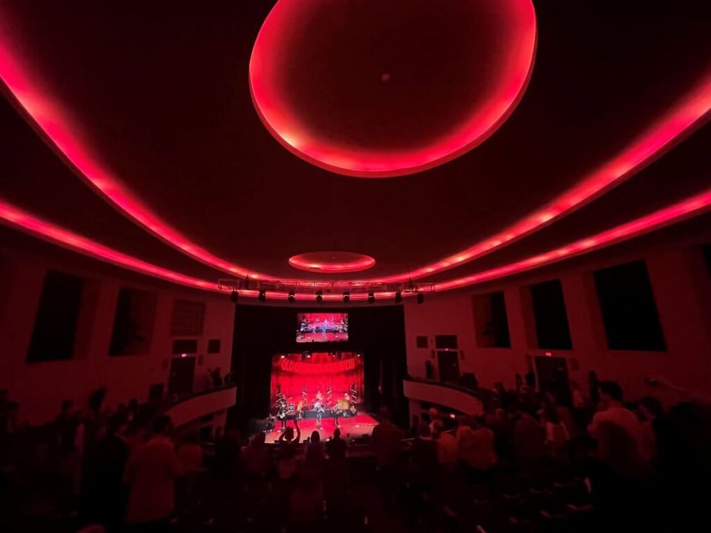 Inside the Chevalier during a concert, with new LEDs lighting the theatre in a red glow.